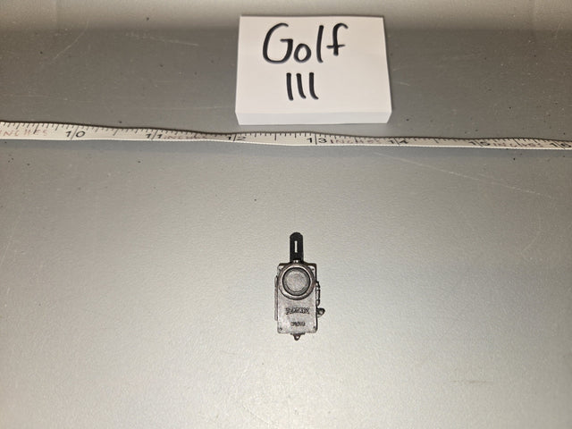 Looking at the small scale model against the ruler, it appears to measure roughly 1/6 scale. The object appears to be a vintage/WWII era handheld radio or walkie-talkie with an antenna. 1/6 Scale WWII US Handheld Radio - Golf III